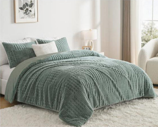 Green textured comforter on a bed in a bedroom with Megatex branding.