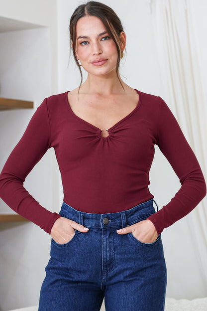 Roxana Top - Ribbed V Neck Long Sleeve Top with Gold Metal Accent in Wine
