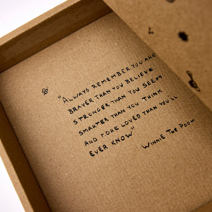 Gender-neutral baby shower gift box in warm natural tones