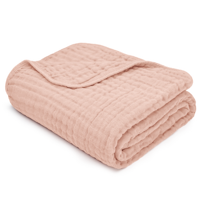 Soft pink muslin cotton blanket folded, perfect for wrapping and snuggling babies, 100% breathable and cozy.