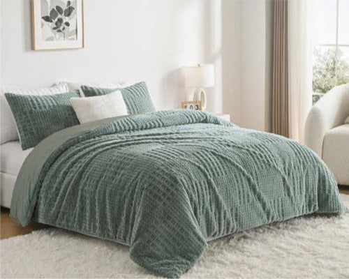 Green textured comforter on a bed in a bedroom with Megatex branding.