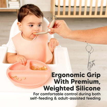 Toddler using Silicone Baby Spoon for self-feeding at high chair