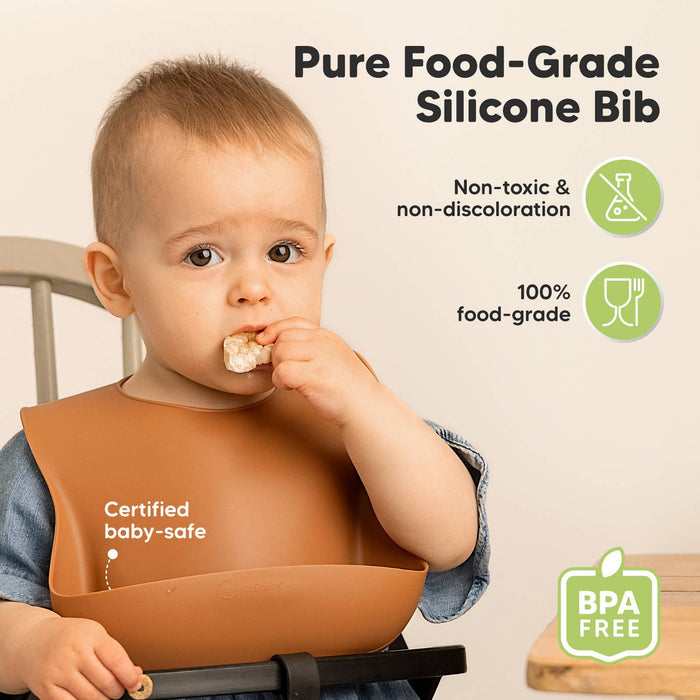 Baby wearing KeaBabies Silicone Bib, BPA-free, pure food-grade, non-toxic, non-discoloration; perfect for toddlers, boys, and girls.